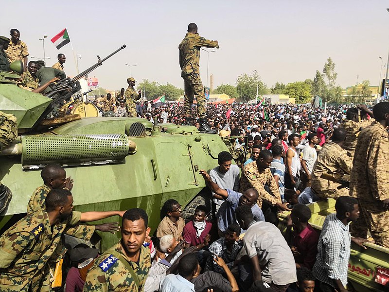 Sudanese soldiers stand guard around military vehicles as demonstrators continue their protest against the regime on April 11, 2019. Columnist Milly Zafar believes that any US or international interference in Sudan will worsen the situation.   