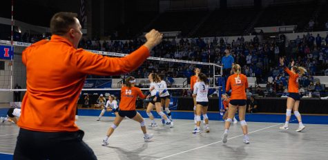 The Illinois volleyball team celebrates after their win against Kentucky on Dec. 4. The team attributes their success to their on road games during the conference play.