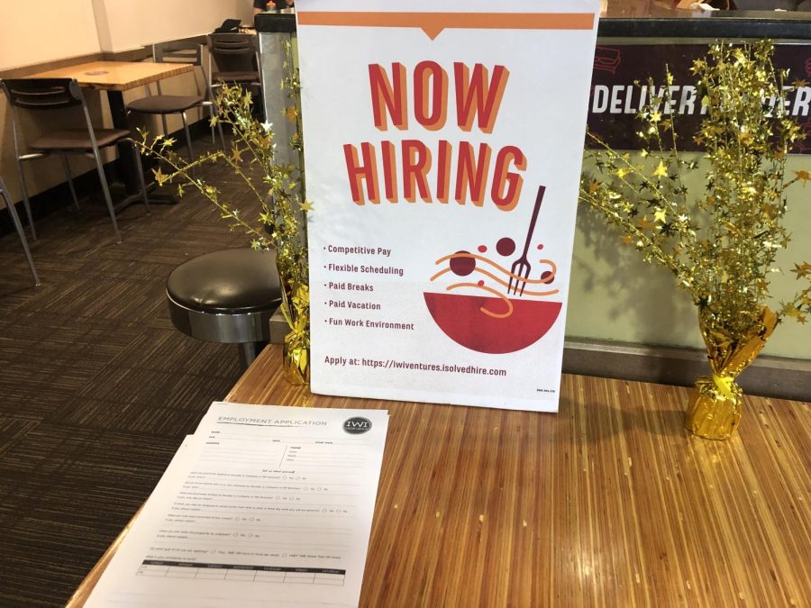 A+now+hiring+sign+sits+on+a+table+at+Noodles+%26+Company.+College+seniors+say+it+is+difficult+to+get+a+job+despite+the+labor+shortage.