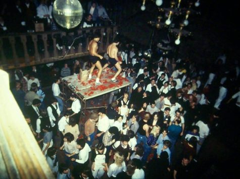 People dance on a table at Chester Street Bar in Champaign. The bar, which was one of Champaigns only gay bars, closed in 2017.