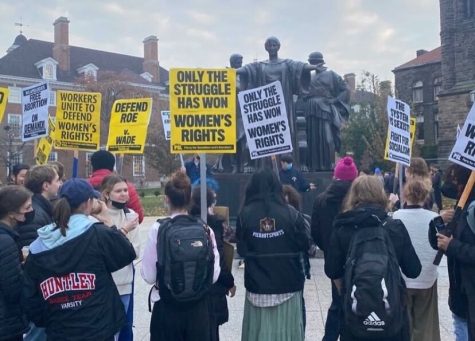 A group of students protest at Alma Mater for a rally set up by PSL on Dec. 2. The rally was in defending Roe v Wade  in response to the recent Supreme Court decision. 