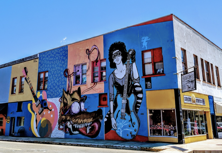 A mural is displayed on the side of a building in Clarksville Mississippi where Gies College of Business started a program for students to conceptualize a business that would benefit this developing community. 