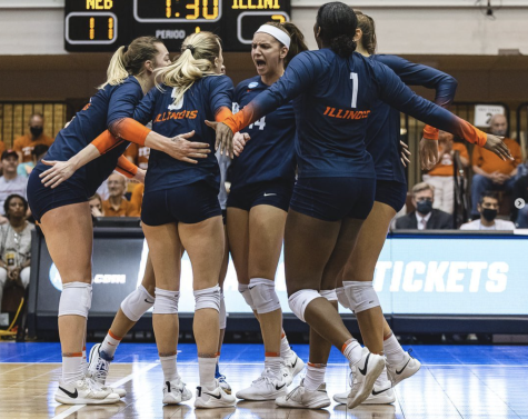 Members of the Illinois volleyball team celebrate during the game against Nebraska in Austin, Texas on Dec. 9. University students are thankful for the eventful volleyball season and trip to Texas.