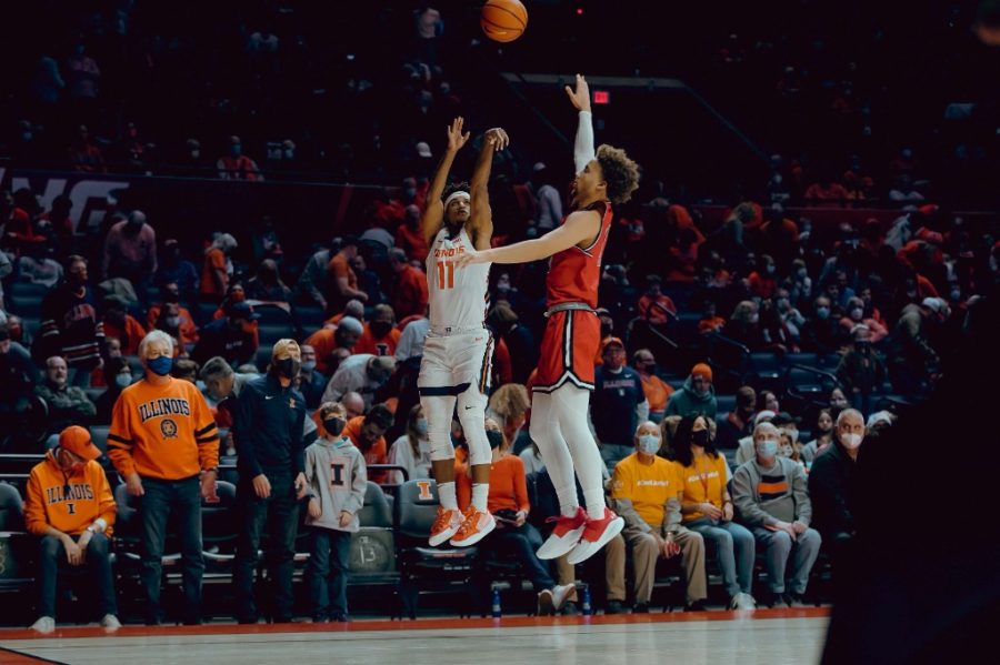 Alfonso Plummer shoots a 3-pointer in the first half of Illinois 106-48 win over Saint Francis (Pa.) at State Farm Center on Saturday. The Illini set a new program record with 18 triples during Saturdays blowout win.