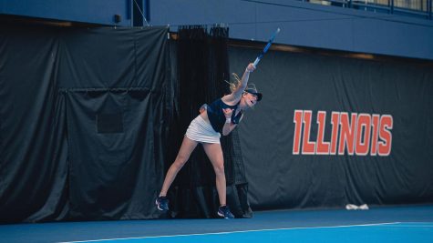 Illinois Womens Tennis Josie Frazier swings the ball back during the game against Harvard on Jan. 20. The Illini won and sweeped Harvard 7-0. 