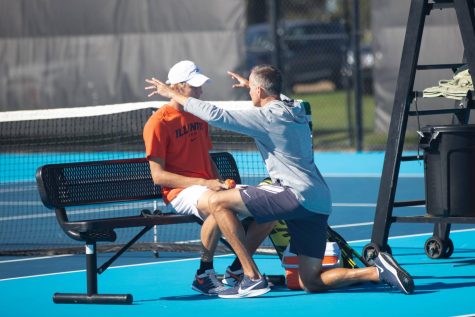 Illinois Mens Tennis head coach, Brad Dancer talks with Gabrielius Guzauskas duirng the Fighting Illini Invite on Oct. 17. The Illini will be up against rival Ohio State on Saturday. 