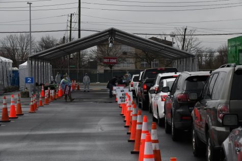 Vehicles line up for a drive-through COVID-19 testing center at Staten Island on Mar. 19, 2020. Columnist Aparna Lakkaraju believes that with the recent rise in COVID-19 it shows the unequal treatment for those with less accessibility to testing. 