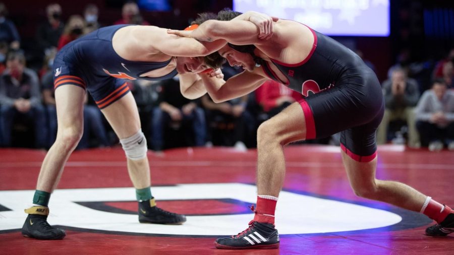 Wrestler+Justin+Cardani+grabs+a+hold+of+his+opponent+during+the+Big+Ten+Opener+against+Rutgers+on+Jan.+4.++The+Illini+lost+against+the+Rutgers+21-13.+