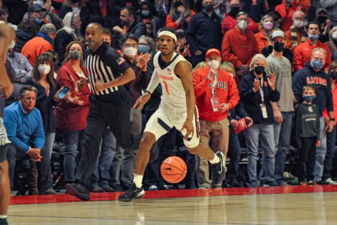 Trent Frazier dribbles with the ball during the first half of the Illinois mens basketball game against Michigan State at State Farm Center on Tuesday night.