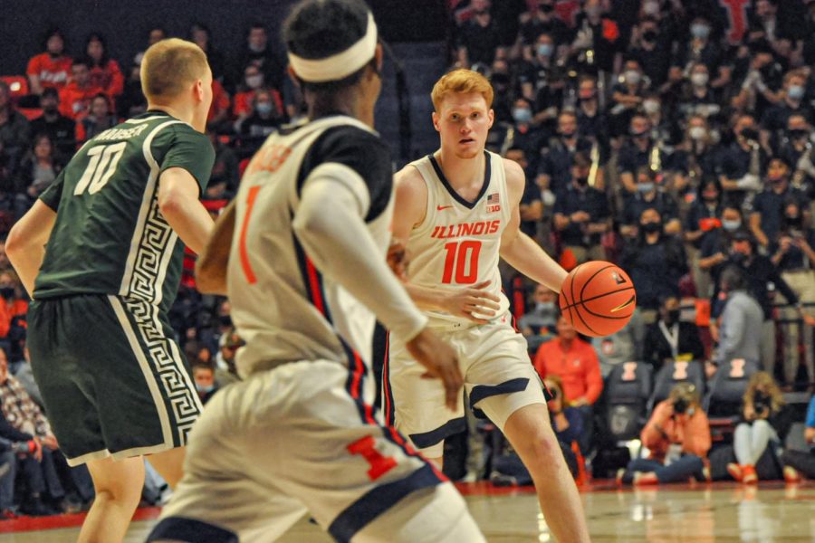 Freshman guard Luke Goode dribbles the ball while looking to teammate senior guard Trent Frazier during Illinois mens basketballs 56-55 win over Michigan State at State Farm Center on Tuesday. Goode played his best game in an Illini uniform in the one-point win.