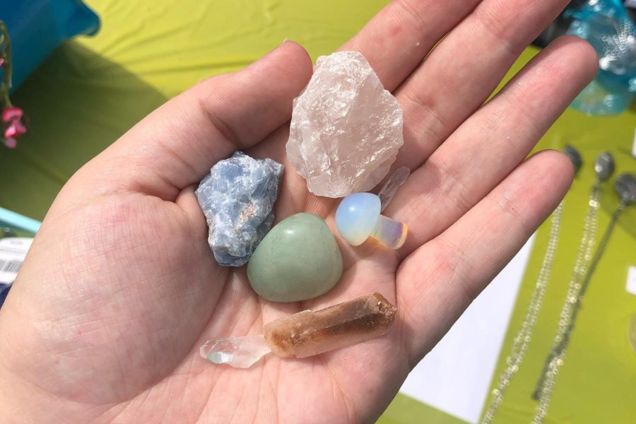 Senior Jenna Glassman holds crystals that she sells for her business, SagSun Healing Crystals, on etsy. Glassman is one of many students out there that utilize crystals in improving mental wellness. 