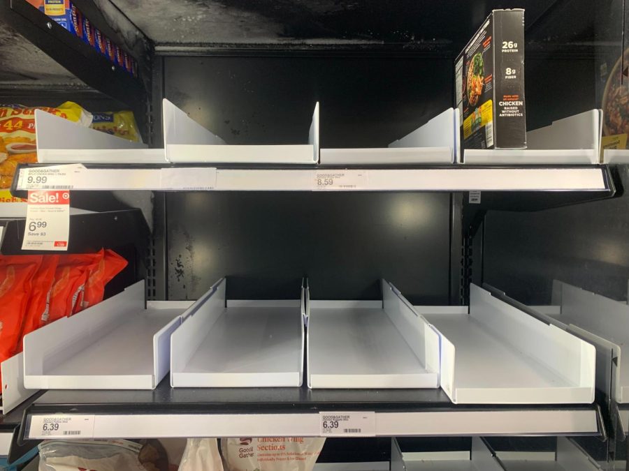 An empty shelf of frozen food sits in the Target on Green street. Other locations around town are dealing with supply shortages that many students say are impacting their eating routines.
