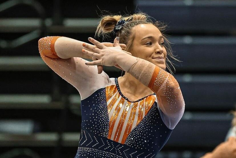 Gymnast+Abby+Mueller+does+her+routine+on+the+floor+during+the+meet+against+Michigan+on++Feb.+2.+The+Illini+won+their+meet+against+CMU+194.150-193.425.+