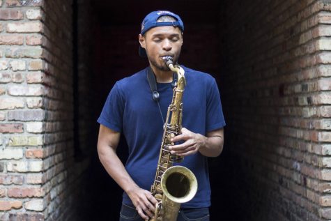 Kevin King plays the saxophone outside of The Canopy Club on Sept. 20, 2019. King, a graduate of FAA, plays a wide range of instruments, but has been more drawn to the saxophone. 