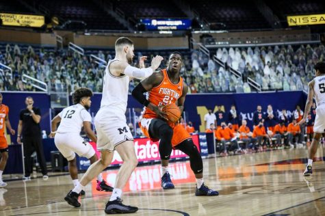 Kofi Cockburn battles for position against Michigan center Hunter Dickinson during the game on March 2, 2021. The Illini will take on the Wolverines in Champaign on Friday night.