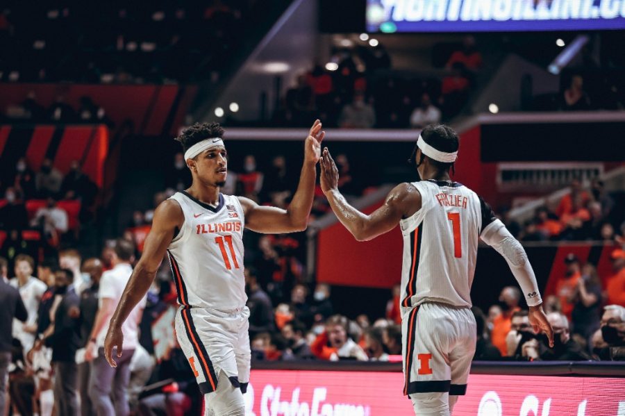 Guards Alfonso Plumer and Trent Frazier high-five during the game against St. Francis on Dec. 18. The Illini will be up against Minnesota on Tuesday. 