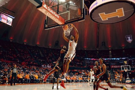 Omar Payne dunks the basketball during Illinois game against Maryland at State Farm Center on Jan. 6. Payne will likely play more minutes for the Illini on Friday after Kofi Cockburn was ruled out after entering concussion protocol.