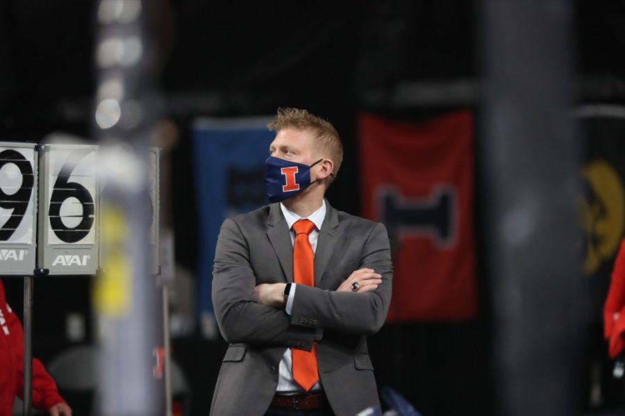 Illinois mens gymnastic head coach, Justin Spring, watches an event during the 2021 Big Ten Championship on  April 3, 2021. The mens and womens team both will be competing at Penn State on Saturday. 