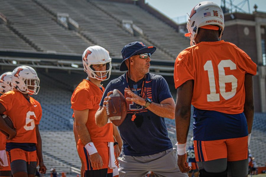 Tony+Petersen+works+with+the+Illini+quarterbacks+during+summer+training+camp.+Petersen+was+fired+as+offensive+coordinator+by+the+Illini+after+one+year+in+Champaign.