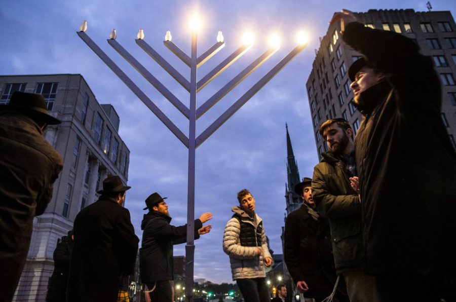 People gather for the lighting of Pennsylvania’s Menorah on Nov. 30. Columnist Hamza Haq discusses the prevalence of antisemitism in relation to the flyers seen on campus two weeks ago. 
