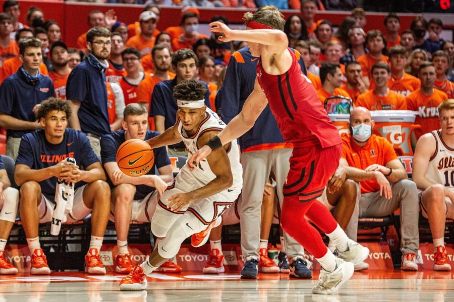 Guard Alfonso Plummer dribbles towards the hoop during the game against Rutgers on Dec. 3. The Illini will be heading to New Jersey on Wednesday for their game against the Scarlet Knights. 