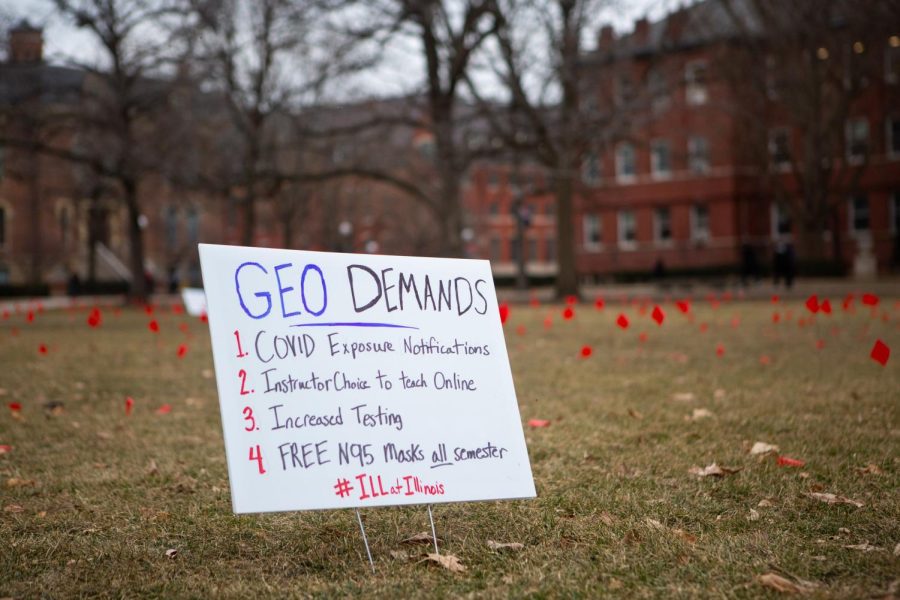 A sign with demands from GEO is displayed on the quad on Tuesday. GEO has now issued a petition in regards to graduate student safety. 
