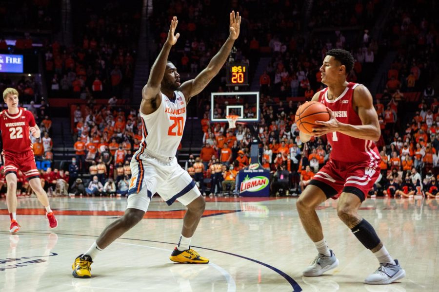 Senior guard, Da’Monte Williams, attempts to block a pass by Wisconsin forward,  Johnny Davis, during the game on Wednesday. Illinois heads to Bloomington, Indiana to play against the Hoosiers on Saturday.