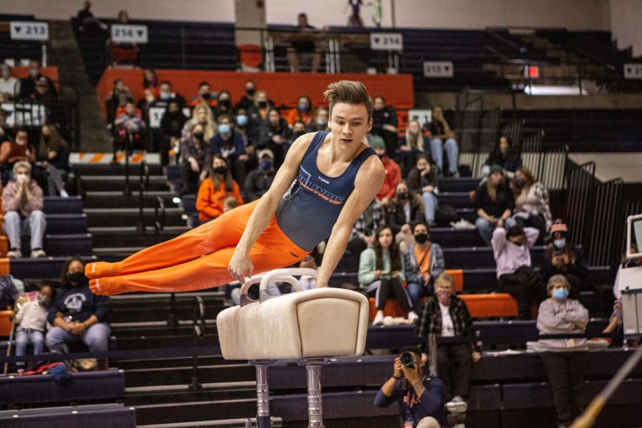 Senior Ian Skirkey balances on top of a pommel horse at the meet against Oklahoma on Saturday. Illinois lost to the Sooners at home.