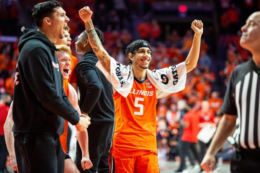 Sophomore guard Andre Curbelo celebrates from the bench during Illinois loss to Ohio State at State Farm Center on Thursday.