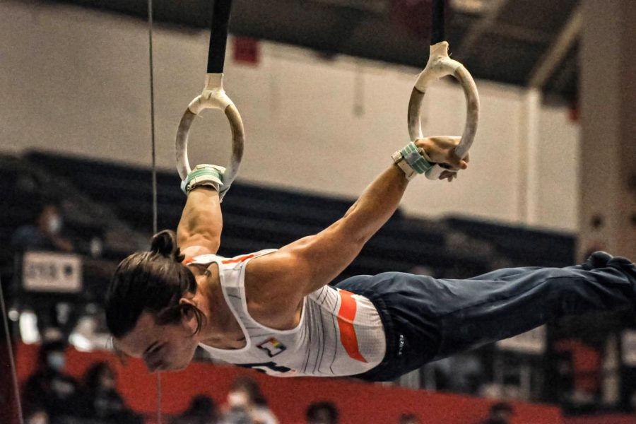 Gymnast Ashton Anaya balances himself during his still rings event against Ohio State on Feb. 5. The Illini will be going against Oklahoma on Saturday for their second home meet of the regular season. 