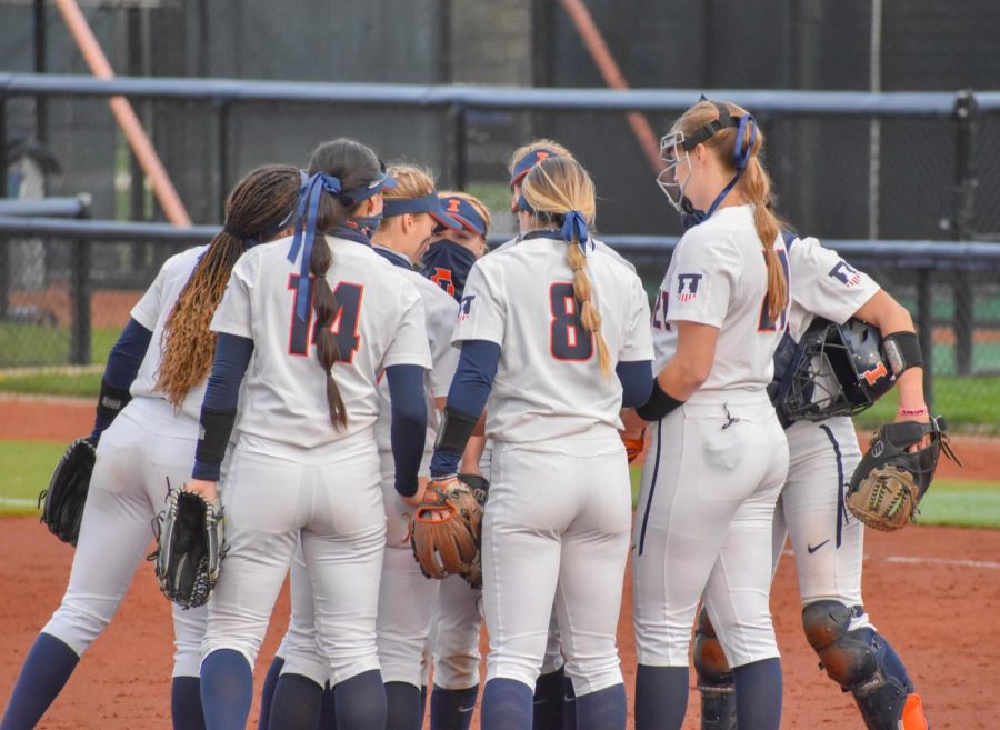 The+Illinois+softball+team+meets+on+the+mound+during+its+game+against+Purdue+on+April+16.+The+Illini+will+begin+their+2022+season+on+Friday+in+Baton+Rouge%2C+Louisiana.
