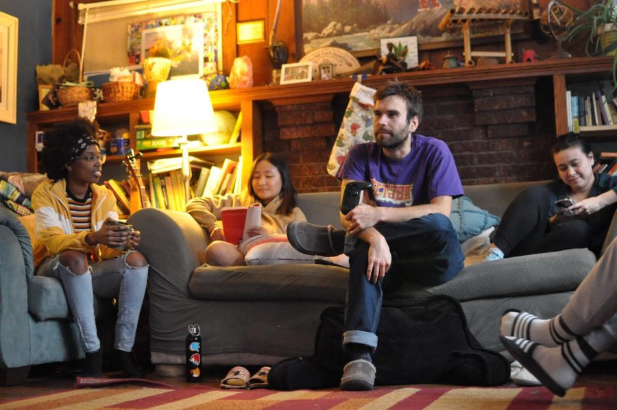 Residents Jada Fulcher, Kei See, Jacob Dixon, and Anri Brod spend their free time in the living room of Harvest House on Saturday. Harvest House is one of three houses a part of COUCH CO-OP.

