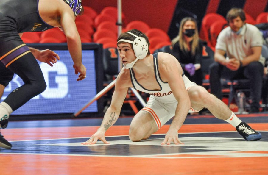 Wrester Lucas Byrd goes towards his Northwestern opponent on Saturday. The Illini will be up against rival Minnesota on Friday. 