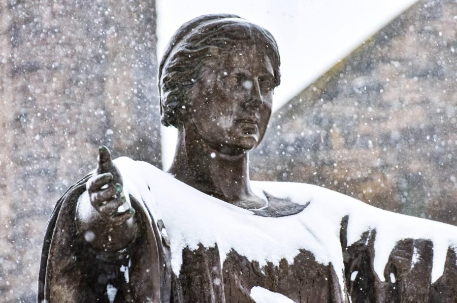Snow piles on the Alma Mater statue on Feb. 2. The University has announced that classes after 2 p.m. will be remote. 