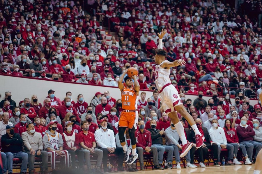 Graduate student guard Alfonso Plummer shoot a 3-pointer during the first half of Illinois 74-57 win over Indiana in Bloomington on Saturday. Plummer recorded 14 points, while senior guard Trent Frazier scored a game-high 23 points and received an A+ grade.