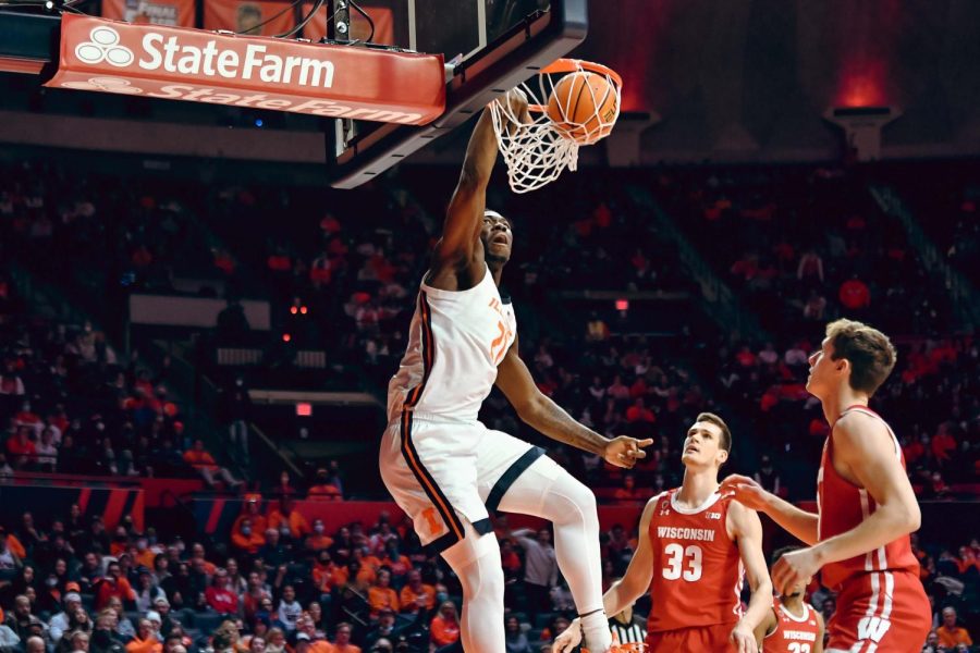 Junior center Kofi Cockburn dunks the basketball during the first half of No. 18 Illinois game against No. 11 Wisconsin at State Farm Center on Wednesday night. Cockburn finished with 37 points and 12 rebonds in the Illinis 80-67 win over the Badgers.