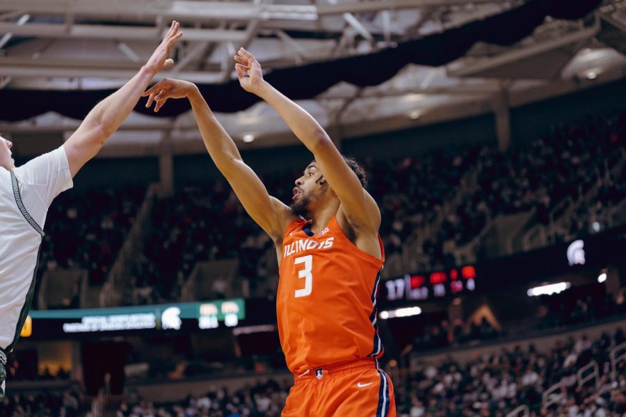 Graduate student forward Jacob Grandison follows through after attempting a shot during No. 12 Illinois 79-74 win over No. 19 at Breslin Center in East Lansing, Michigan, on Saturday. Grandison recorded a season-high 24 points and 6 triples earning him an A+ grade.