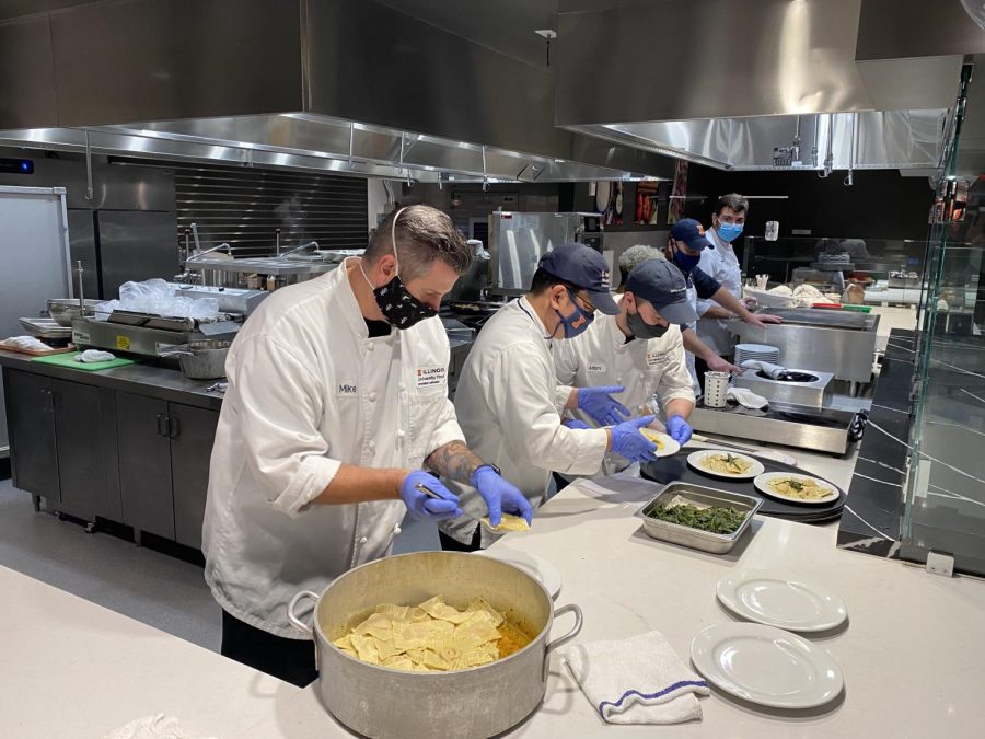 Chef Mike and other University Housing workers prepare food at the ISR dining hall. The dining halls have been working efficiently even with staff shortages. 
