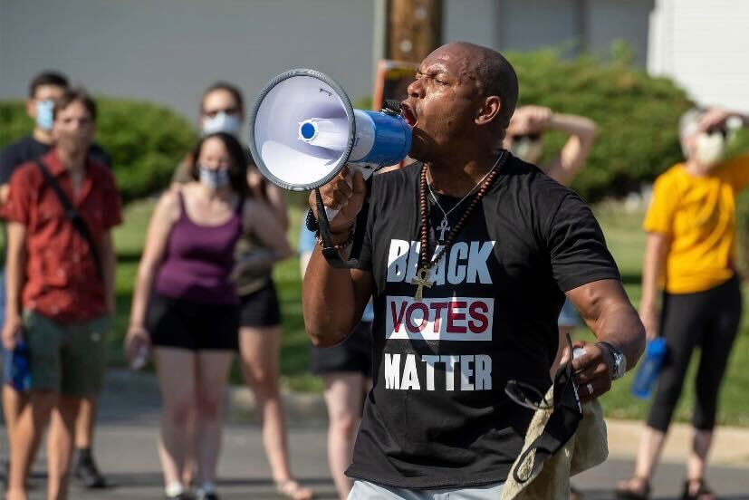 Champaign+County+Clerk+Aaron+Ammons+speaks+during+a+Black+Lives+Matter+protest+during+the+summer+of+2020.+Ammons+talks+about+his+journey+to+becoming+the+country+clerk+in+2018.+