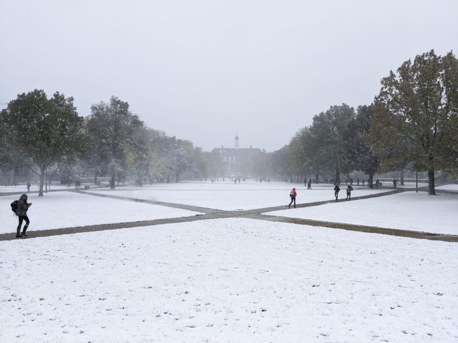 Students walk to class on a snowy day on Oct. 31, 2019. The University has announced classes will be remote from Wednesday to Friday. 
