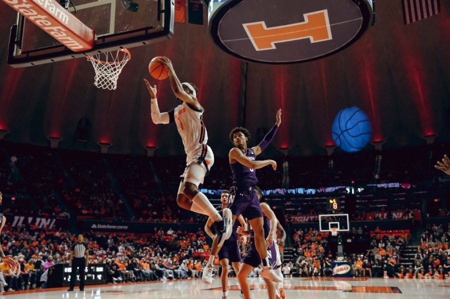 Guard Trent Frazier goes to dunk the ball during the game against Northwestern on Sunday. Recently the Illini struggle during second halves for past games. 