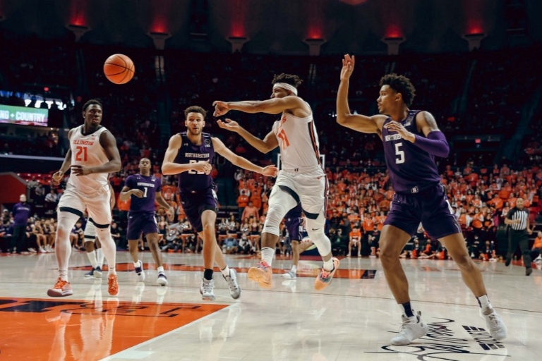 Guard Alfonso Plummer passes the ball during the game against Northwestern on Sunday. The Illini lose against Rutgers 70-59 on Wednesday. 