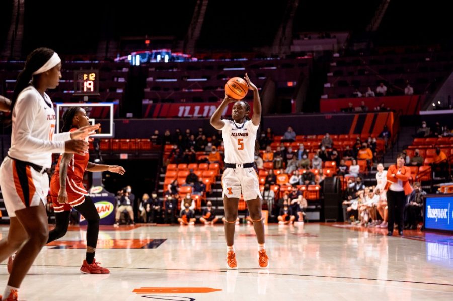 Guard DeMyla Brown shoots form the three point line during the game against Rutgers on Sunday. The Illini fall against the Scarlet Knights. 56-66. for their last regular season game. 