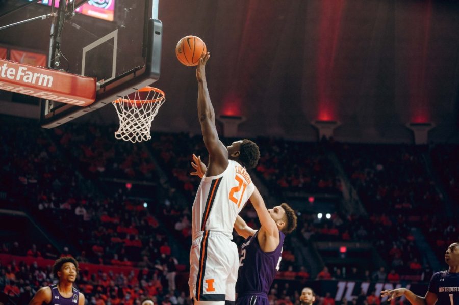 Center Kofi Cockburn shoots the ball into the hoop during the game against Northwestern on Sunday. Cockburn gained 19 points and 15 rebounds during the game. 