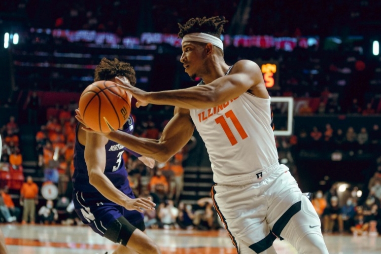 Guard Alfonso Plummer passes the ball during the game against Northwestern on Sunday. The Illini struggle during the second half of the game, but still win against the Wildcats. 