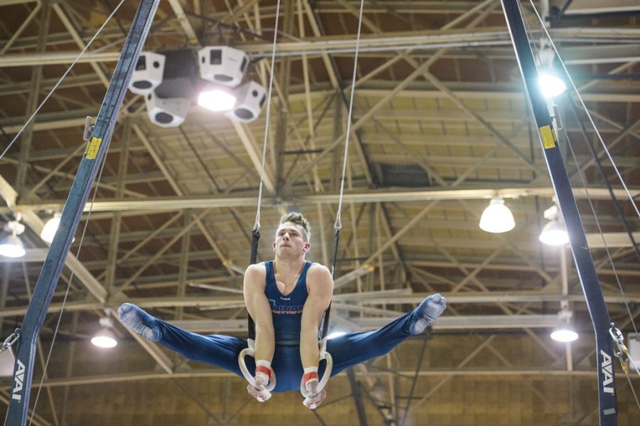 Gymnast Jordan Kovach balances during his event for still rings during a meet on Mar. 17, 2018. Both the mens and womens teams will be back home with the mens team competing on Saturday and the womens team on Sunday. 