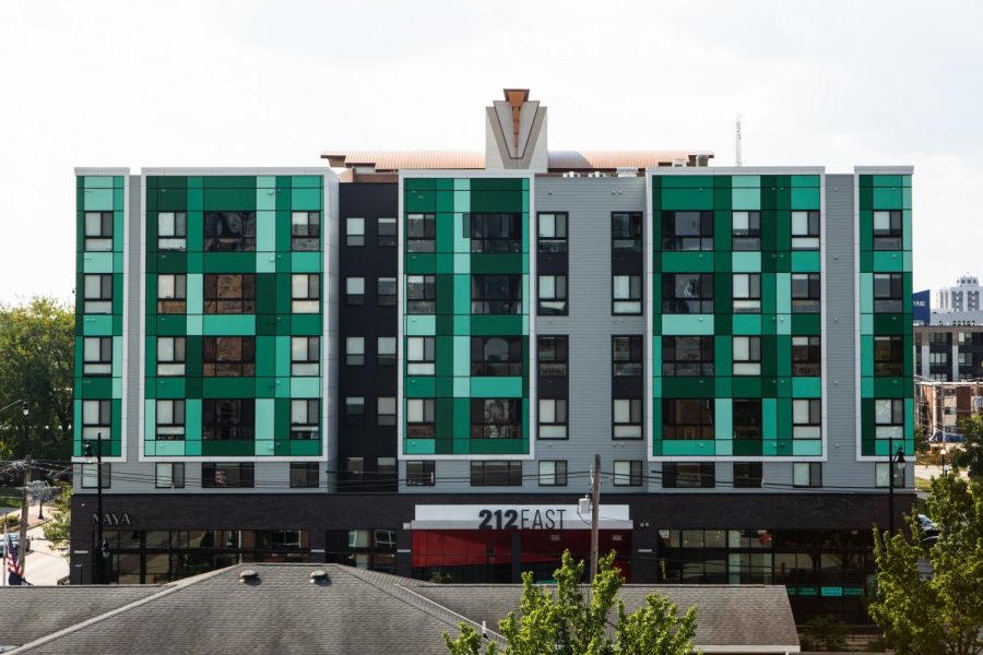 212 East, one of many apartment buildings located on Green Street, allow students to be in a closer range of campus. Columnist Diamond Walker argues that the University should focus more on creating more affordable housing closer to campus in making the student population more connected. 