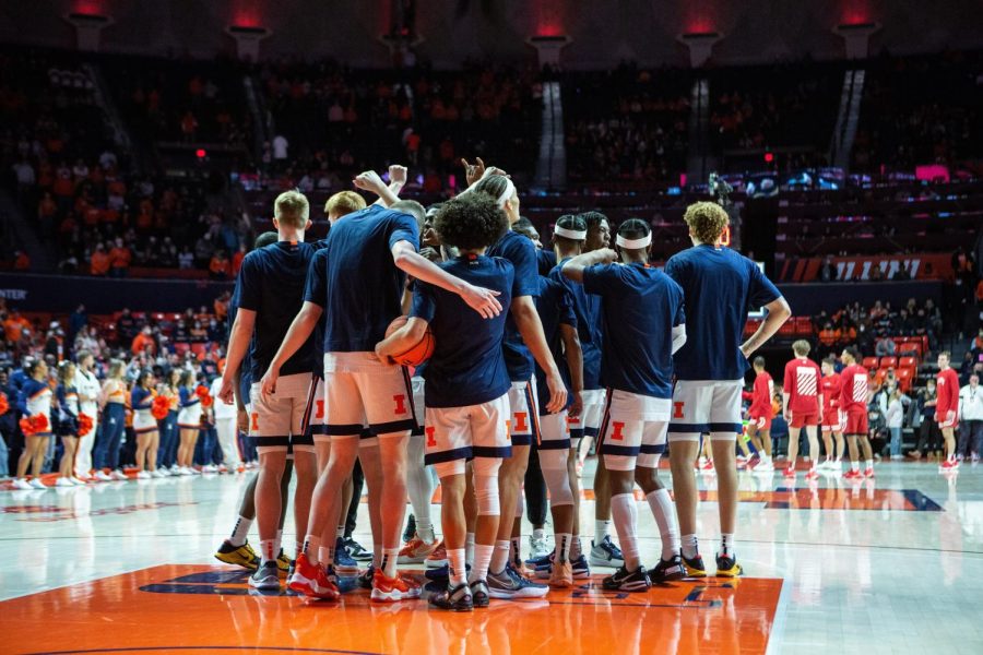 The Illinois mens basketball team huddles before its game against Wisconsin at State Farm Center on Feb. 2.