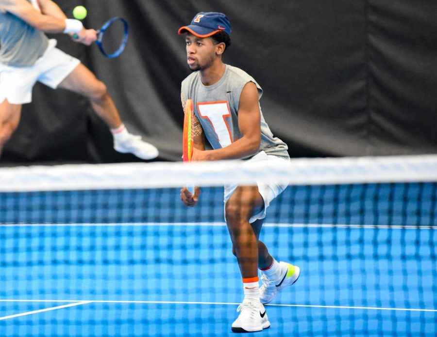 Redshirt Junior Siphosothando Montsi gets ready for his doubles match as his partner, graduate student Oliver Stuart, hits the ball during their match against Duke on Feb. 19. Montsi and Stuart won their doubles match against Penn State, 6-3, and the Illini overall sweeping Penn State 4-0. 