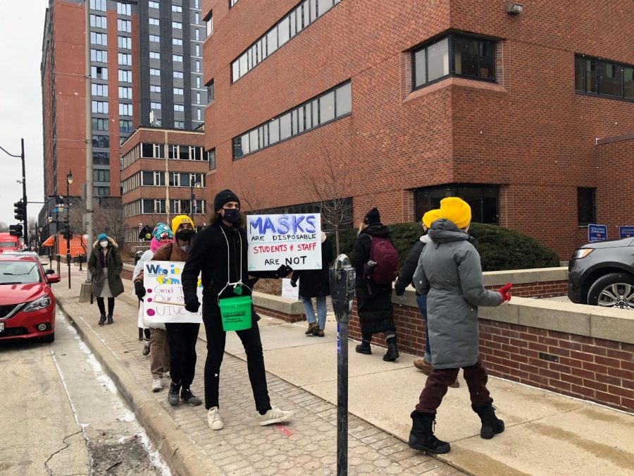 Members of GEO protest against lifted mask mandate in front of the Swuanland Administration Building on Feb. 23. Since them GEO has been fighting with the University in regards to Covid-19 safety. 